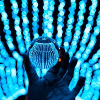 crystal ball stay in blue garland lights decoration for winter holidays